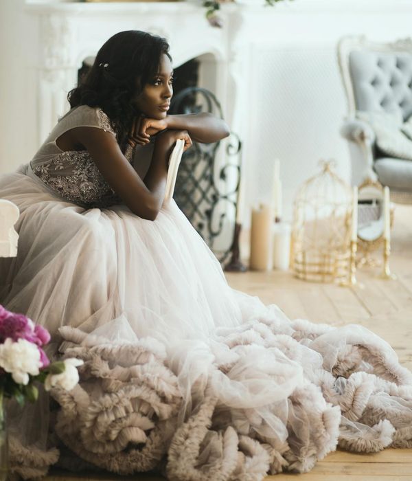 Woman feeling energized and calm in a bright, modern room.